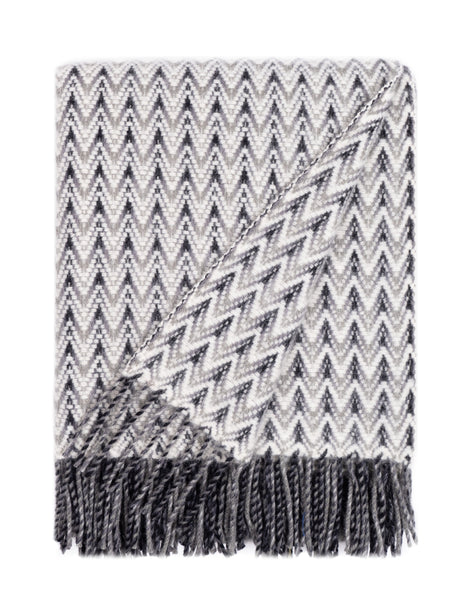 Grey wool throw blanket featuring elegant wave-like texture and fringed detail,. New Zealand Wool